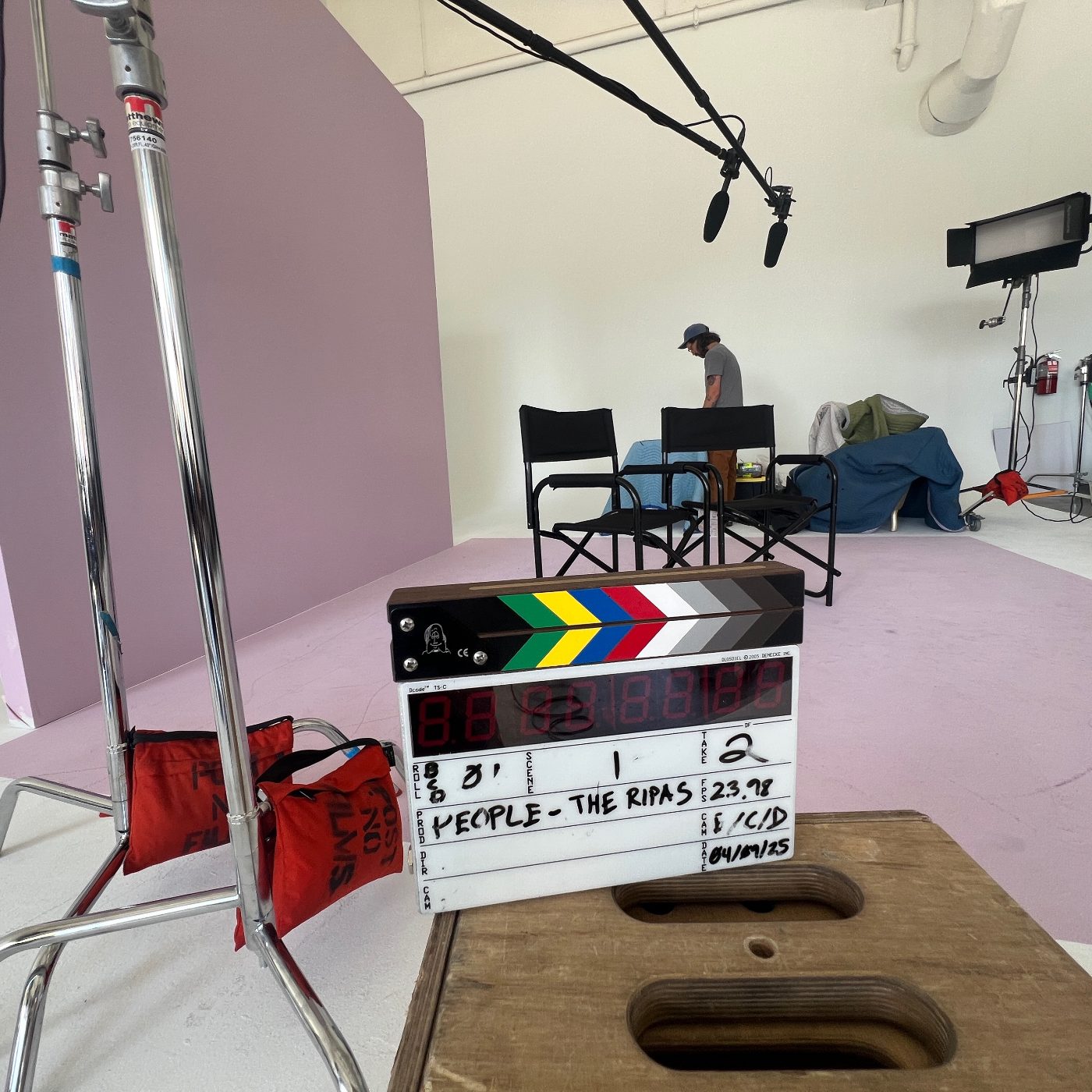 Dual boom microphones rigged overhead on a studio interview set in New York City, slated for a People magazine shoot